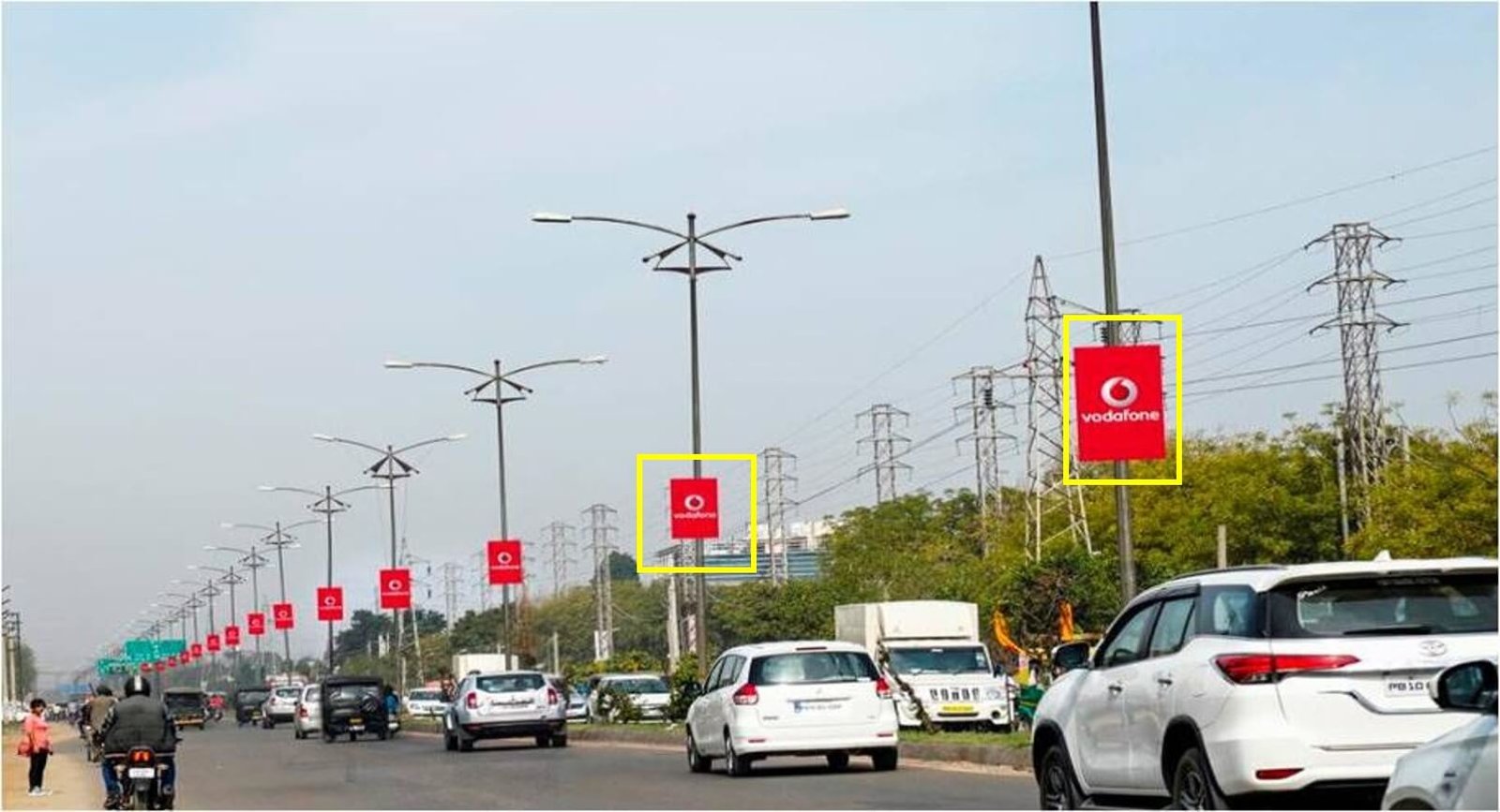 Pole kiosk advertising in Mumbai by ACME Advertising Co., showcasing vibrant street-level branding on high-traffic roads.