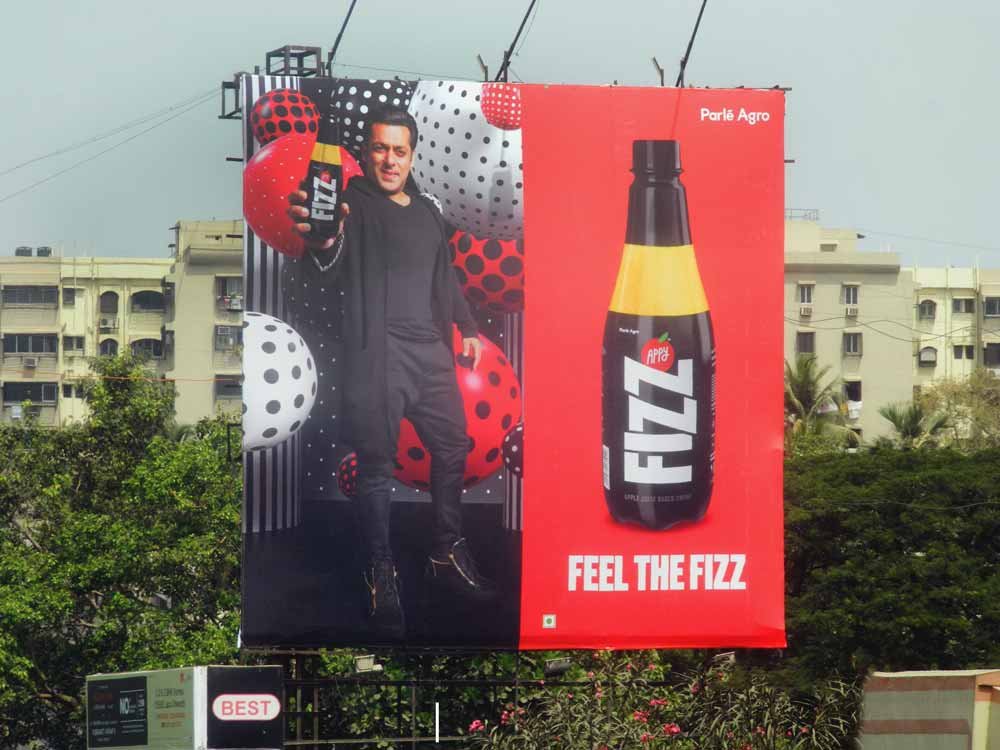 Outdoor advertisement featuring a high-impact billboard promoting a consumer product