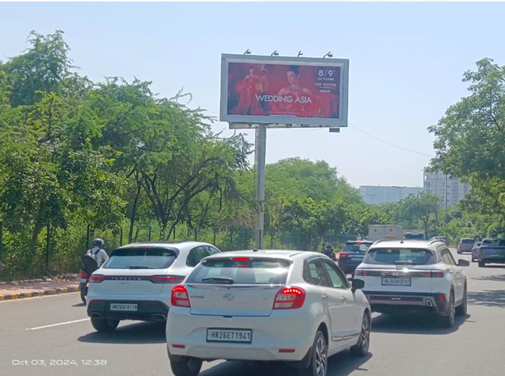 Large outdoor hoardings displayed on busy streets in Delhi, showcasing creative brand advertisements installed by top hoarding advertising companies.