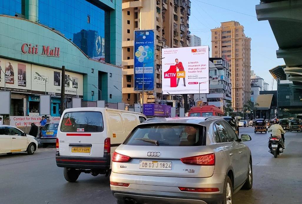 Unipole advertising companies in Mumbai showcasing a large outdoor billboard on a busy road with high traffic visibility