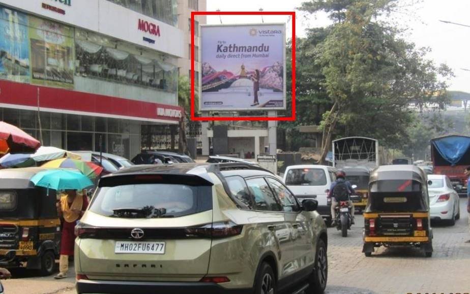 Unipole advertising companies in Mumbai showcasing a large outdoor billboard on a busy road with high traffic visibility