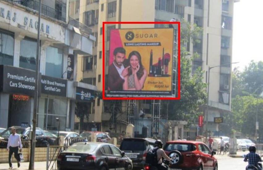 Unipole advertising companies in Mumbai showcasing a large outdoor billboard on a busy road with high traffic visibility